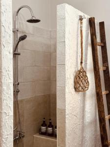 a bathroom with a shower with a shower head at Dimora da Adele in Termoli +45 photos