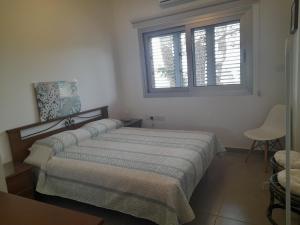 Ένα ή περισσότερα κρεβάτια σε δωμάτιο στο Olive & Pinetree House