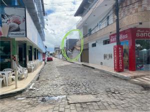 a cobblestone street in a city with buildings at Apartamento Baixu 2 in Prado