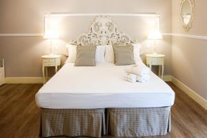 Postel nebo postele na pokoji v ubytování B&B Le Bianche