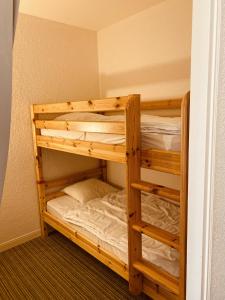 a bunk bed in a room with a bunk bed in a room at Opale Sun Hardelot in Neufchâtel-Hardelot +4 photos