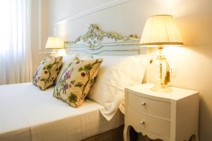 Postel nebo postele na pokoji v ubytování B&B Le Bianche