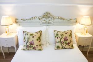 Postel nebo postele na pokoji v ubytování B&B Le Bianche