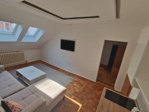 a living room with a couch and a tv at No work in Ivišovo Greblje