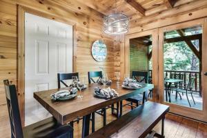 a wooden dining room with a table and chairs at Your Getaway Oasis in Sevierville