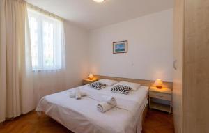 Posteľ alebo postele v izbe v ubytovaní Apartments Tamarix