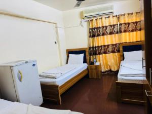 Postel nebo postele na pokoji v ubytování Al Khaima Hotel