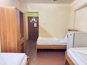 Postel nebo postele na pokoji v ubytování Al Khaima Hotel