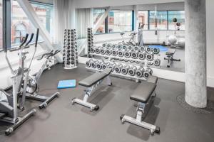 a gym with a lot of exercise bikes and weights at U&Me; BW Signature Collection in Umeå