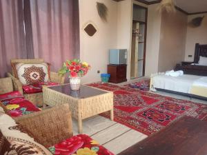 Postel nebo postele na pokoji v ubytování kasbah amlal