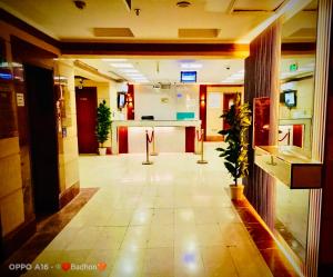 an empty lobby with a counter in a building at Hotel Chatha Manoura- in Medina +10 photos