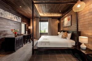 Postel nebo postele na pokoji v ubytování Scenic Mountain Ecolodge Ninh Binh