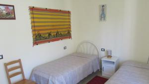 Postel nebo postele na pokoji v ubytování Casa Roberta a Lucca