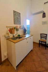 Kuchyň nebo kuchyňský kout v ubytování B&B Ginestra
