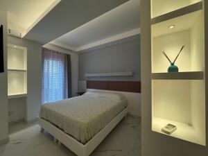 Ένα ή περισσότερα κρεβάτια σε δωμάτιο στο VILLA Porto Garibaldi