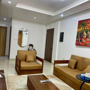 a living room with two couches and a table at 3 Bedroom Dakar Plateau View of Gorée in Dakar