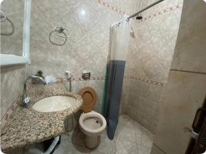 a bathroom with a sink and a toilet at Residence Fonteles in Sobral +14 photos