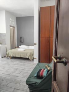 a bedroom with a bed and a couch in a room at Green Art Studios in Rome