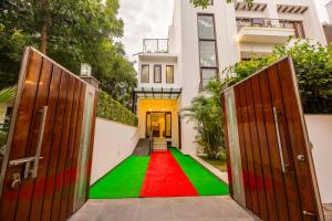 a house with a colorful floor in front of a house at Eco-friendly luxury awaits you with Garden in Gurgaon
