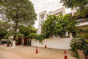 a building with orange traffic cones in front of it at Eco-friendly luxury awaits you with Garden in Gurgaon