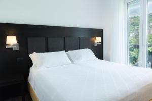 Кровать или кровати в номере Hotel Florida Lerici