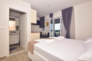 Ένα ή περισσότερα κρεβάτια σε δωμάτιο στο Anka Apartments