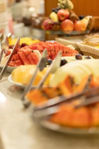a bunch of plates of food on a table at Hotel Prata Villaggio in Nova Prata