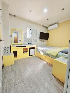 a bedroom with a bed and a desk in it at Dreaming Hostel Sinchon Hongdae in Seoul +34 photos