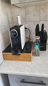 a black and white appliance sitting on top of a counter at Casa Manzoni in Novara