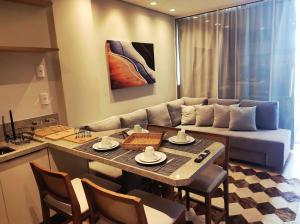 Χώρος καθιστικού στο Encanto de Flat no Serra Class