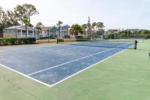 a tennis court with two tennis courts at Palm Sol in Tybee Island