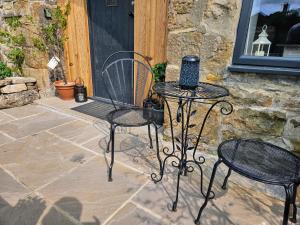 Patio nebo venkovní prostory v ubytování Cosy Coach House + 9 fotografií