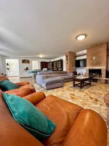 a large living room with couches and a fireplace at Dori Affittacamere in San Lorenzo