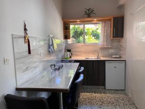 A kitchen or kitchenette at Nikos Studios