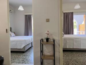 A bed or beds in a room at Nikos Studios