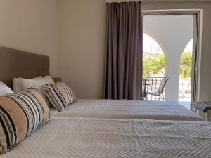 A bed or beds in a room at Nikos Studios