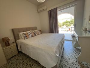 A bed or beds in a room at Nikos Studios