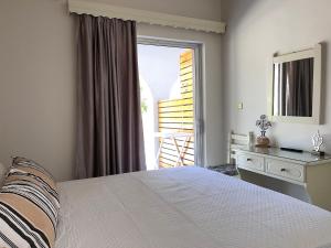 A bed or beds in a room at Nikos Studios