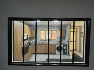 a view of a kitchen through a window at RaJan Home in Palizzi Marina