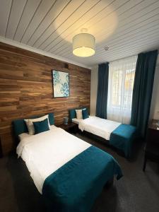 Postel nebo postele na pokoji v ubytování Sunny Hotel