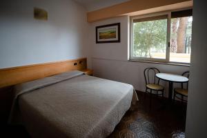 A bed or beds in a room at Residence Stella Maris