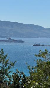 a large ship in a large body of water at Vila Bedro in Sarandë