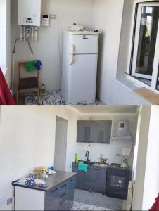 a small kitchen with a white refrigerator and a sink at Apartment near to the centre in Nukus