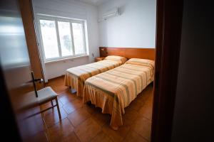 A bed or beds in a room at Residence Stella Maris