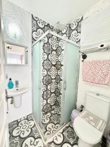a bathroom with a toilet and a sink at Aişem By Hire in Alaçatı +58 photos