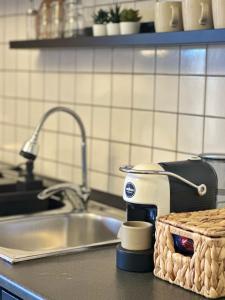a kitchen counter with a mixer on a sink at VISTA MARE IN CENTRO STORICO Casa di Sara in Sciacca +33 photos