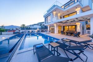 a villa with a swimming pool and a house at Villa Lovelet 2 in Kas