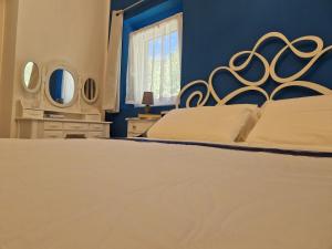 Postel nebo postele na pokoji v ubytování Il sentiero b&b