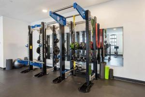 a gym with a bunch of equipment in a room at Optimum - Downtown Oasis in Birmingham