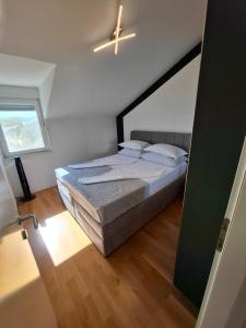 Postel nebo postele na pokoji v ubytování Apartment Tin